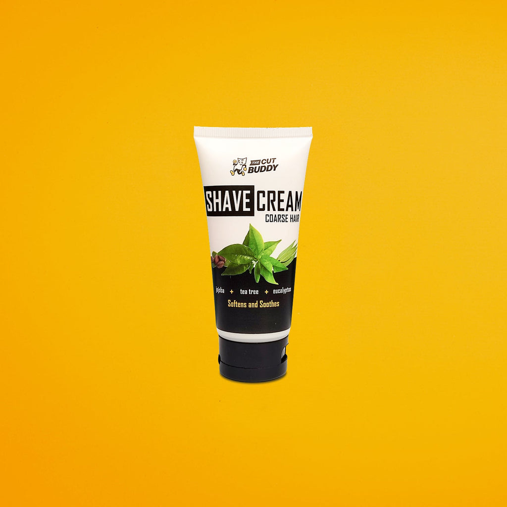 The Cut Buddy Shave Cream for coarse hair, enriched with jojoba, tea tree, and eucalyptus.