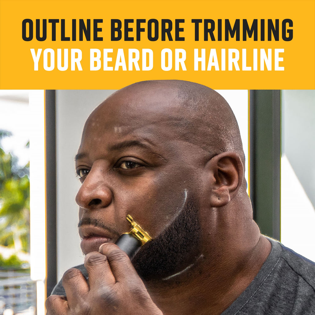 A man looking in a mirror and feeling his neatly defined beard line after using a shaping and guiding tool.