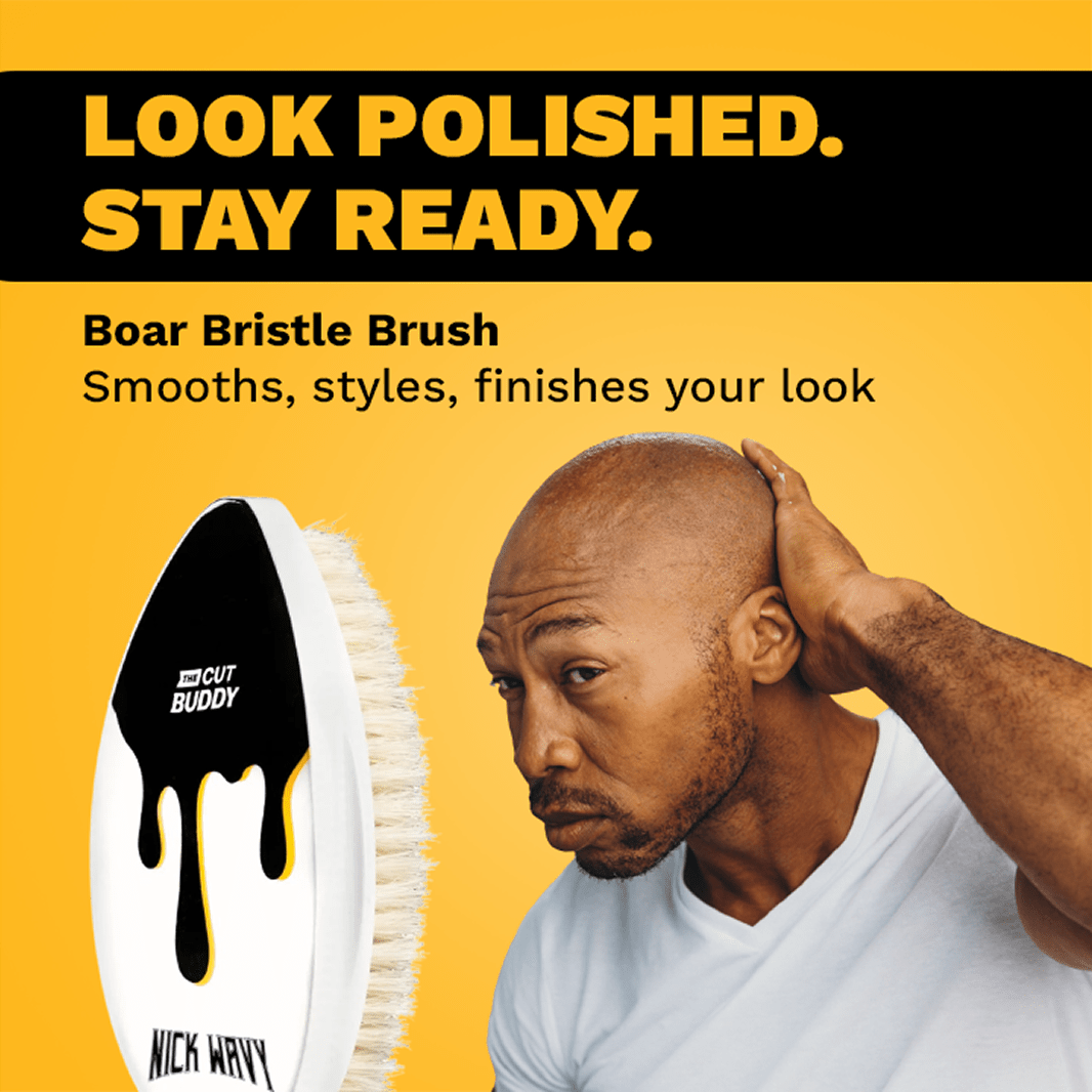 A man using The Cut Buddy soft boar bristle brush to smooth his hair. Text overlay: Look Polished. Stay Ready. Boar Bristle Brush smooths, styles, finishes your look.
