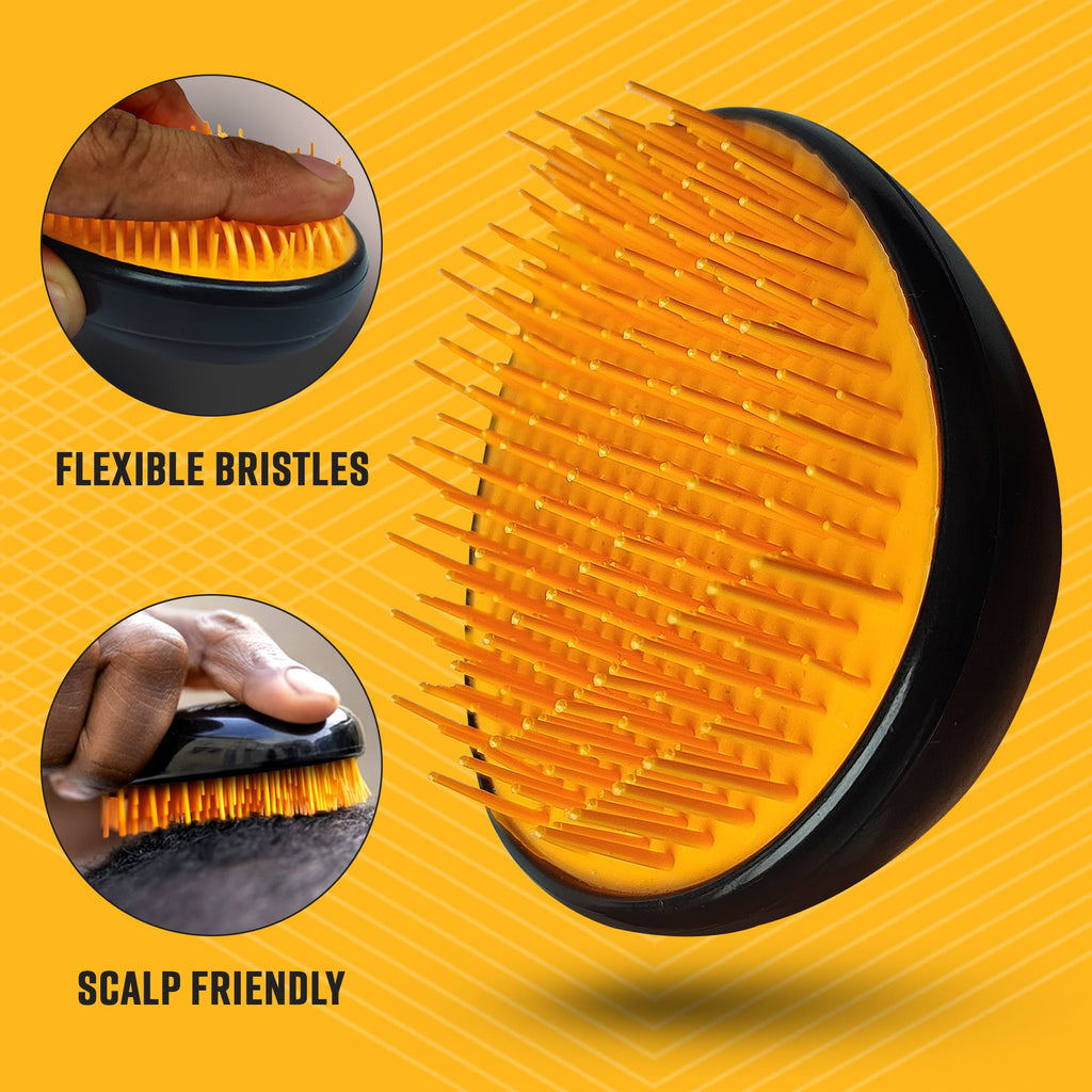 Detailed view of an orange hairbrush with callouts for 'FLEXIBLE BRISTLES' and 'SCALP FRIENDLY' showcasing the soft, bendable spikes