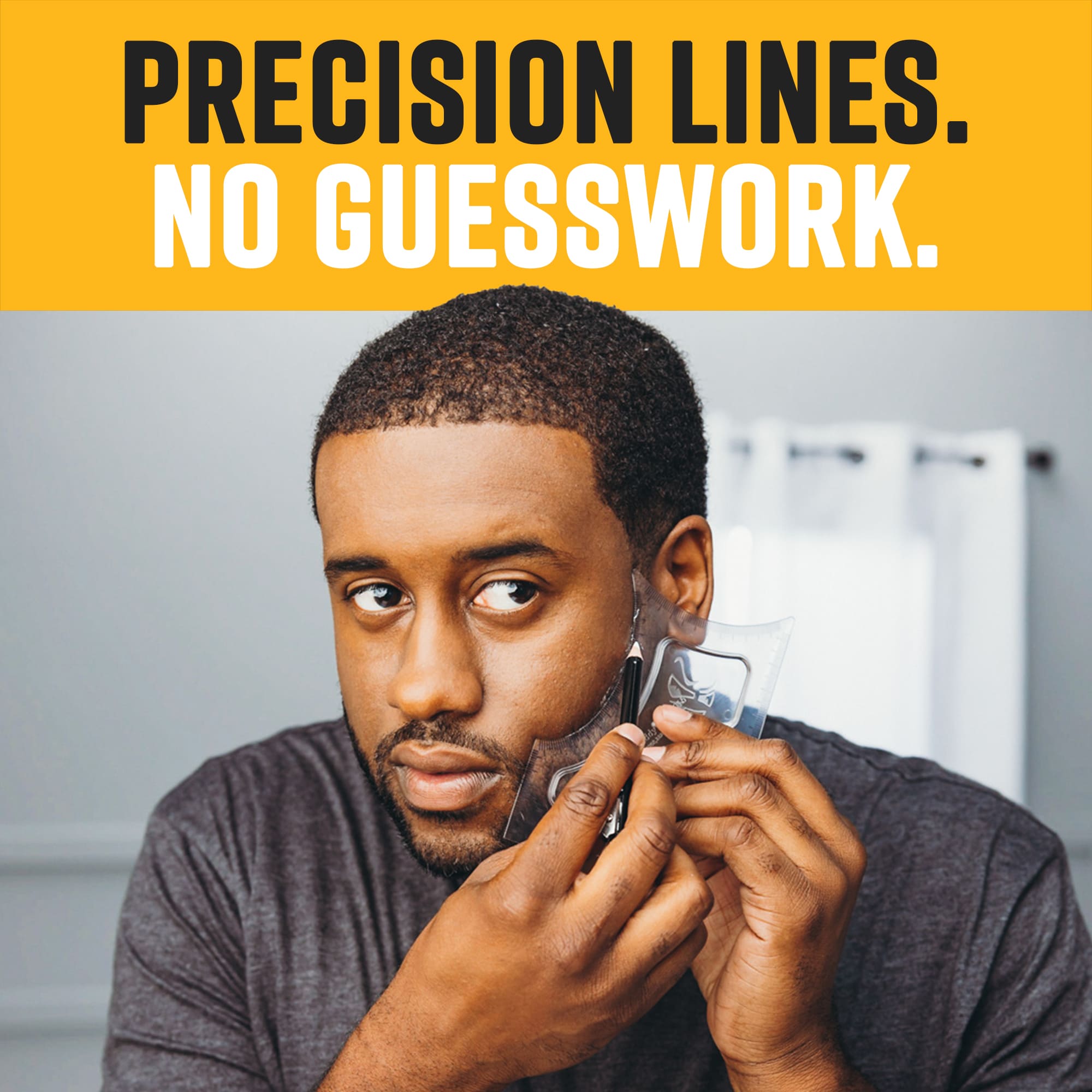 A man looking into a mirror while using a clear grooming stencil and a tracer pencil to define his beard line without guesswork.