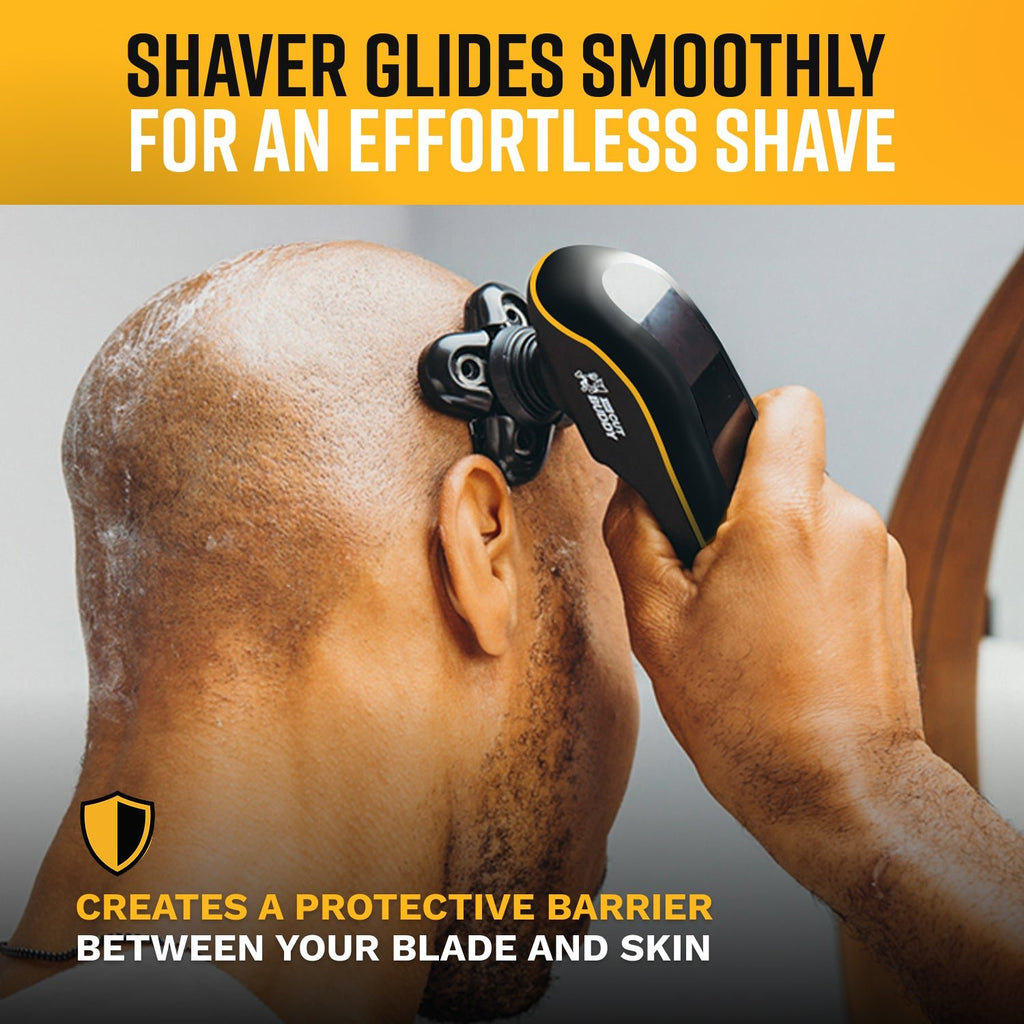Close-up of a head shaver in use, illustrating how it creates a protective barrier between the blade and skin to prevent irritation.