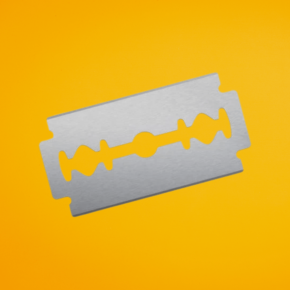 The Cut Buddy replacement double-edge safety razor blades with protective paper wrapper.