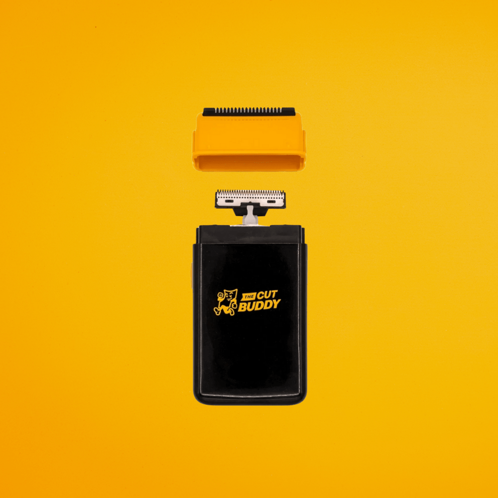 Professional grooming kit featuring an electric beard trimmer and a serrated orange guide for precise edging and detailing.