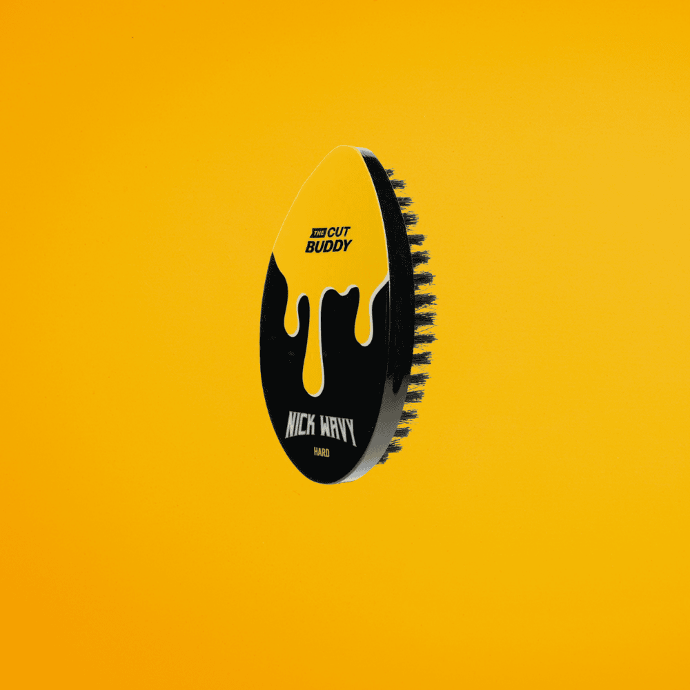 The Cut Buddy Nick Wavy Collection hard wave brush with black and yellow drip design, ideal for wolfing and thick hair textures.