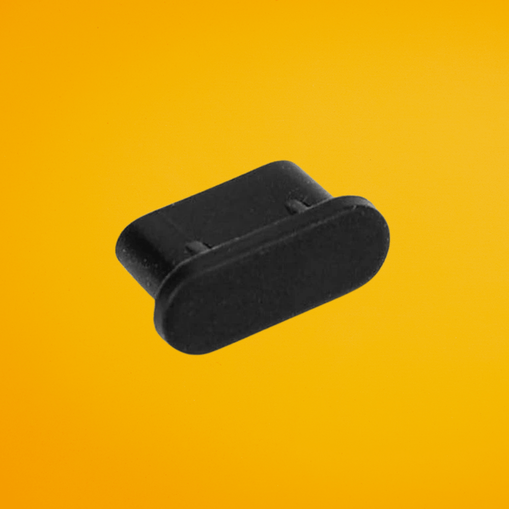 Individual black silicone replacement dust cover for The Cut Buddy clippers and trimmers to prevent debris in charging ports.