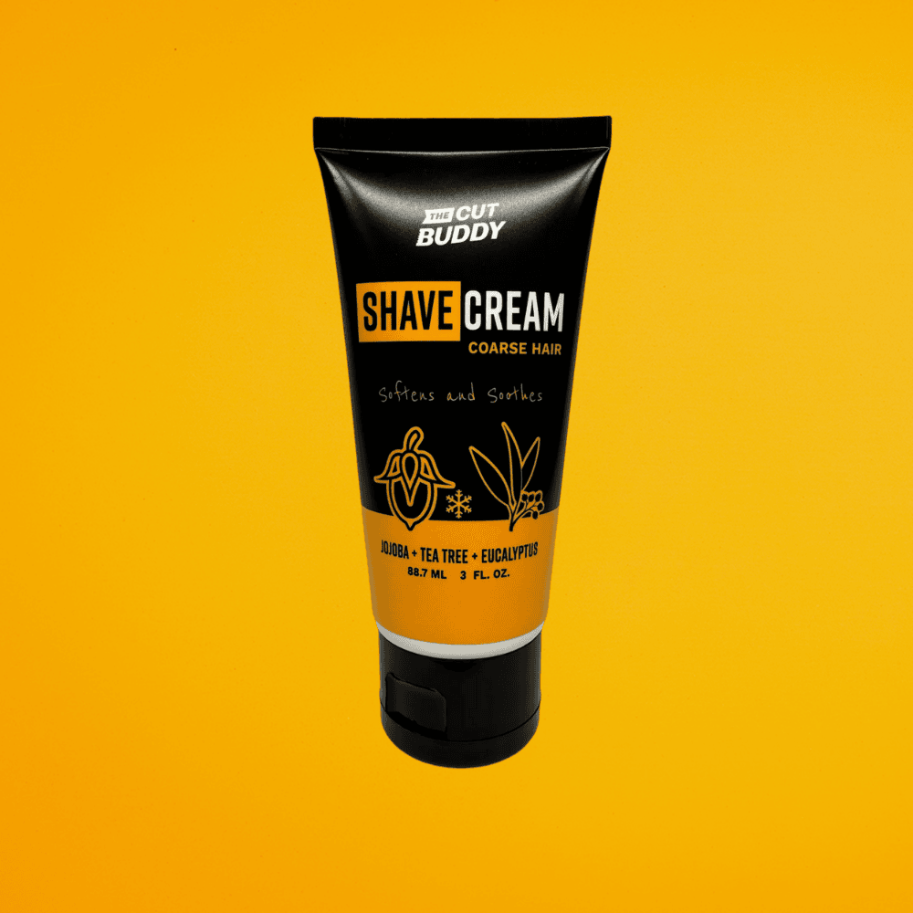 Three ounce tube of The Cut Buddy Shave Cream for coarse hair against a solid yellow background.